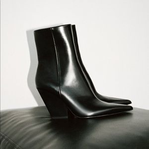 Black pointed toe heeled boots